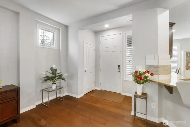 Perfect entry with coat closet right where it should be - BY THE DOOR (not half-way down a hall!). And those gorgeous side-light windows that flank the main entry wall - they bring brilliant light yet preserve privacy.