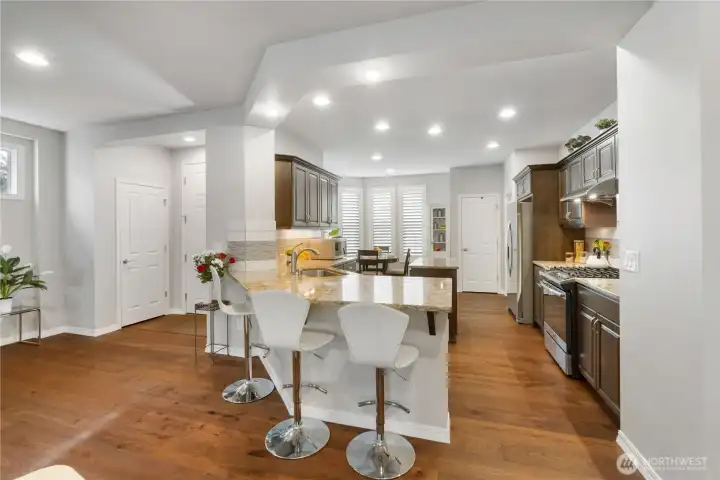 Cool kitchen with nice bar for serving friends and family.