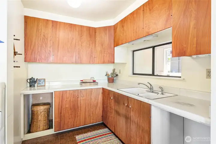 The small but functional kitchen could be refreshed or gut this space and rework the whole space.