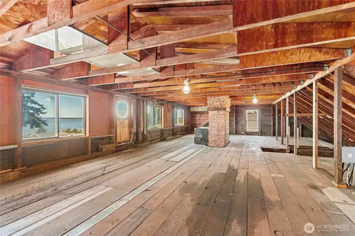 The views from the attic are the best - this space is awaiting your imagination - or if you tear down the home, you can really maximize the view from a second story with a completely new design and build.