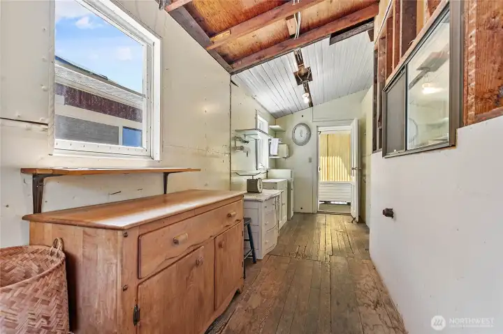 Inside the enclosed porch, you can access the front, back and inside of the house.