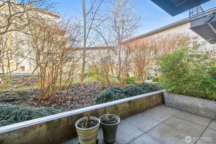 Add colorful potted plants or herb garden to this charming patio.