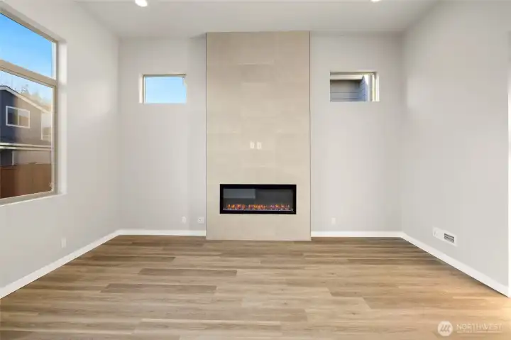 12 ft vaulted ceilings with floor to ceilings tile fireplace