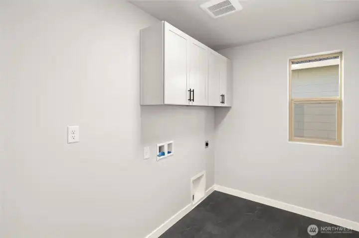 Laundry with upper cabinets