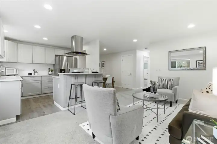Gorgeous remodeled kitchen with luxury finishes: shaker cabinets, quartz counters, subway tile, stainless appliances and eating bar. Lots of counterspace!