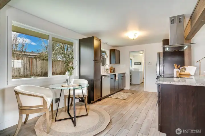 Intimate sitting nook in the kitchen. A nice place to get off your feet while keeping an eye on whatever is happening in the backyard.