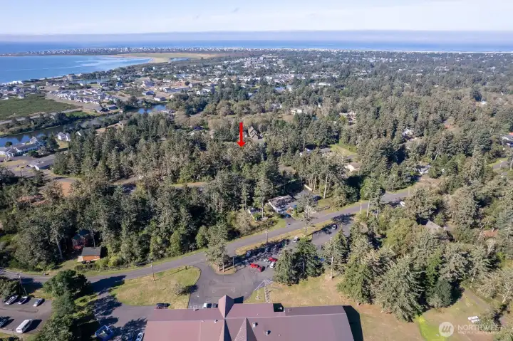 The properties approximate location in relation to The Ocean Shores Community Club.