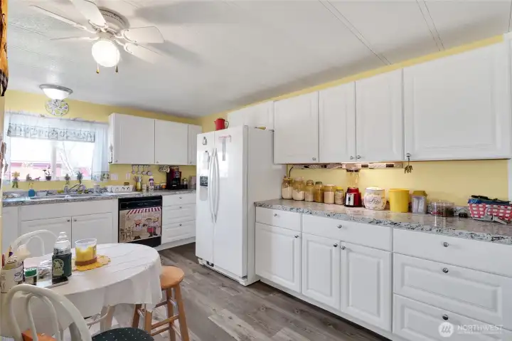 Soooo much cabinet space. Beautiful high quality flooring- refrigerator stays!