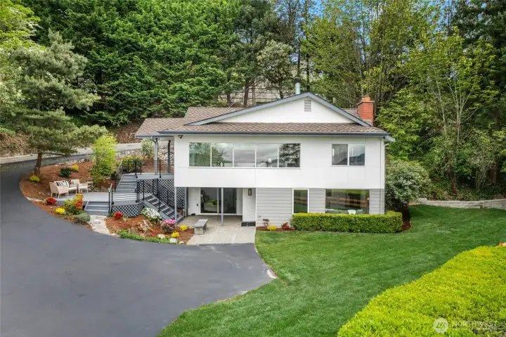 Beautiful 20,460 square feet (shy half acre) of grounds are over 150 feet wide