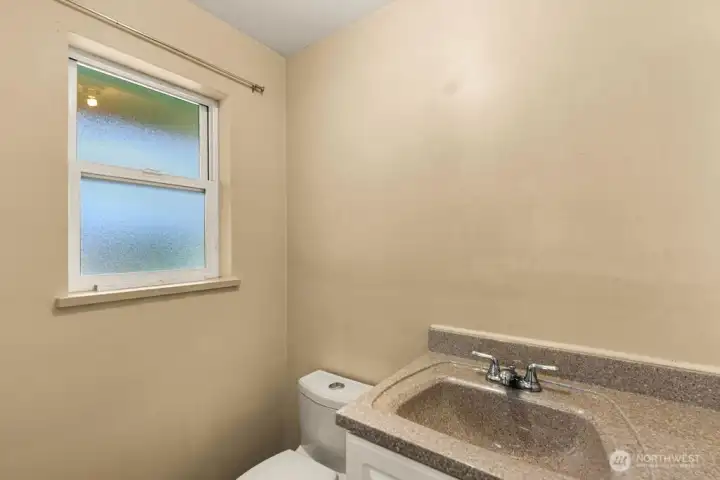 Half Bath off Kitchen & Garage