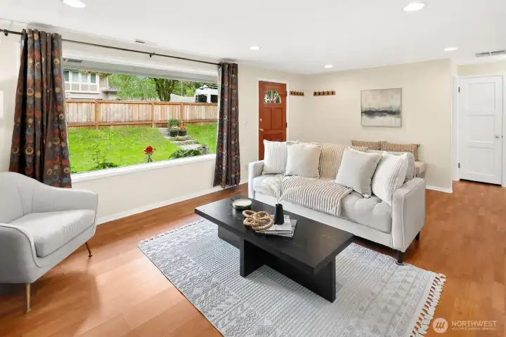 Living room offers plenty of space for entertaining. Bedrooms, bathroom and storage to the right rear.