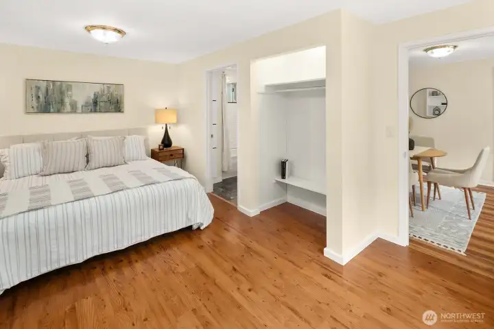 The primary bedroom has a private bathroom and plenty of natural light.