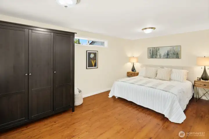 Large primary bedroom suite offers privacy away from other two bedrooms.  There's an ensuite bathroom, and a full wardrobe for storage, in addition to the closet.    This would be large enough for a desk or home office, exercise bike, or whatever activities you need a little more space for!