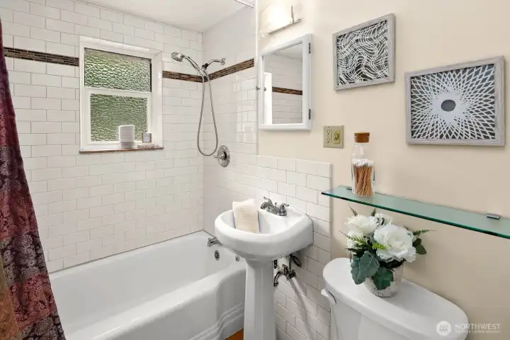 Hall Bath near Bedrooms 2 & 3 is conveniently accessible for guests, as well.