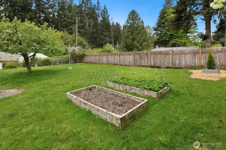 Front yard and driveway is shielded from the street by a wooden fence.  In addition to garage parking, there is driveway parking and plentiful, free street parking.