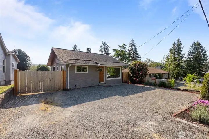 Charming exterior with fresh curb appeal, ample off-street parking and a spacious lot offering flexibility and future potential.