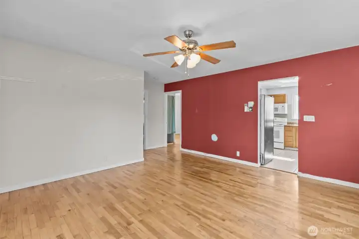 Open and versatile living space with seamless flow into the kitchen and bedroom areas.