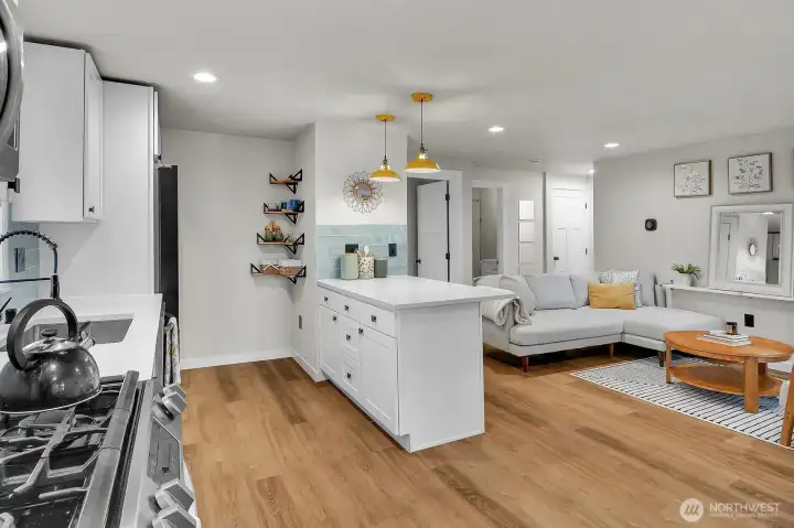 The renovated kitchen offers plenty of storage and an island for additional dining.