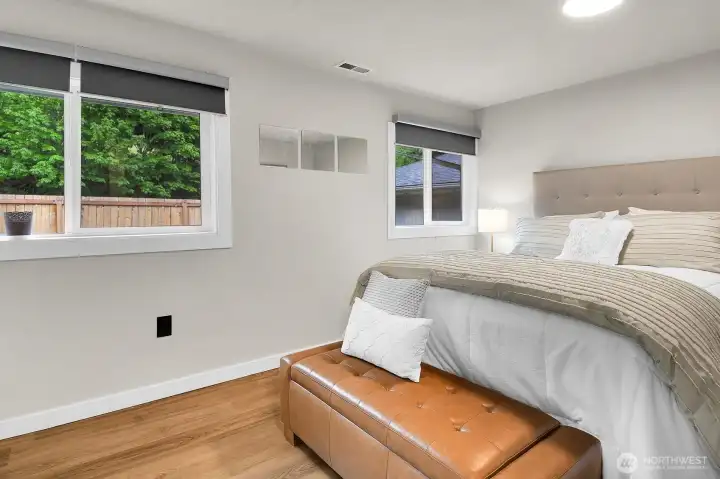 The primary ensuite bedroom offers tons of natural light.