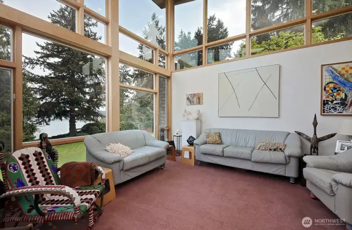 Walls of glass connect indoors to the landscape.