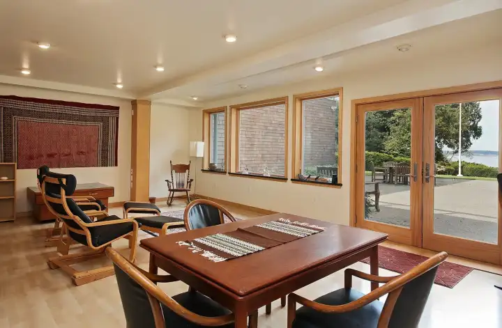 Flexible lower level functions beautifully as a second residence. French doors open to the the large patio.
