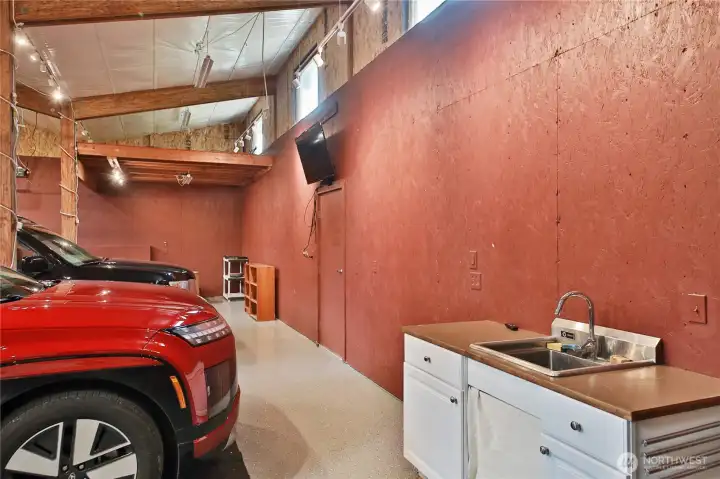 4 bay garage with electricity , television screen Spot lights and heat . Rare space for events of all kinds