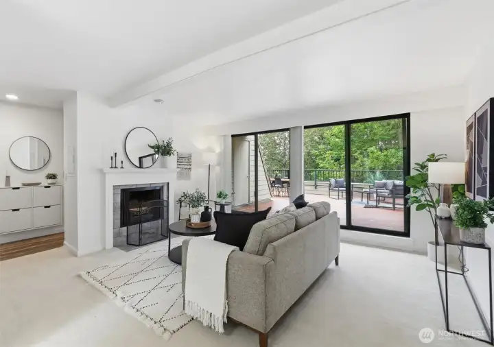 Light & bright living room framed with wood burning fireplace and a deck like no other!