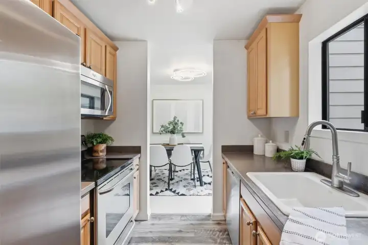 Galley kitchen with tons of natural light.