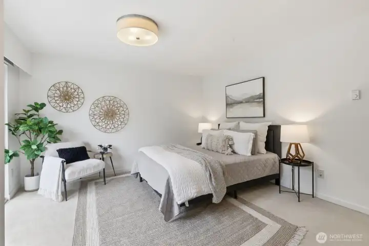 Large primary bedroom with private patio/deck.