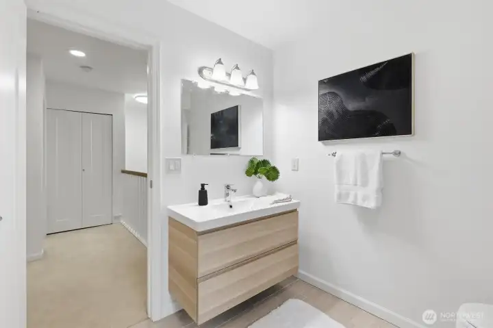 Primary bath shared with dual doors.