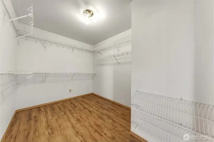 Primary bedroom walk-in closet