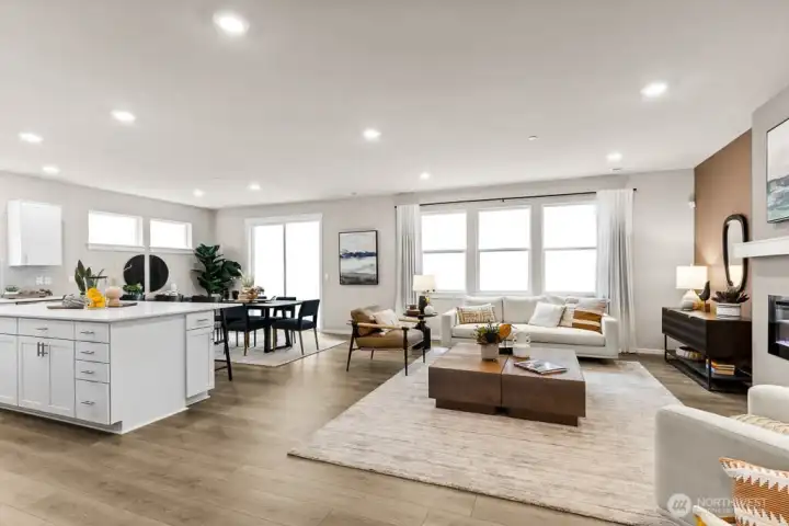 Open concept living with great room, dining room and kitchen. Photo rendering is representational and may be virtually staged. Actual home is under construction and finishes, elevation, and paint colors may vary. See site agent for details.