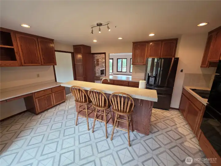 Another view of the large kitchen. Note the opening to the double living room with fireplace Another view of the large kitchen. Note the opening to the double living room with fireplace