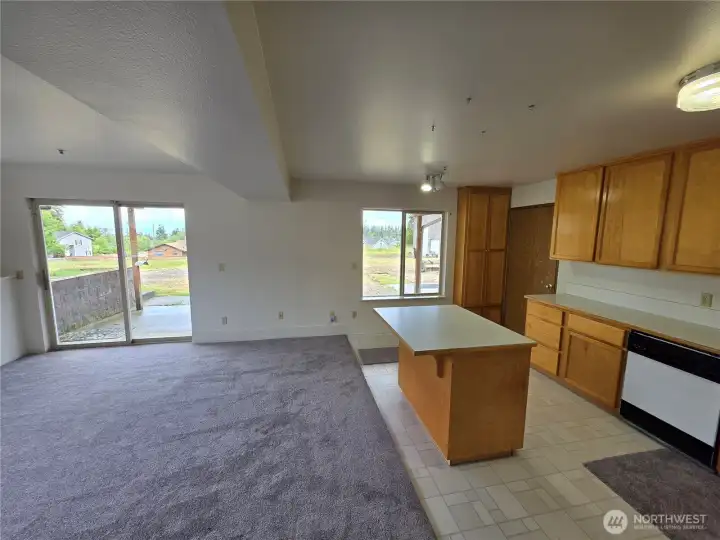 Another view of kitchen and living room. Another view of kitchen and living room.