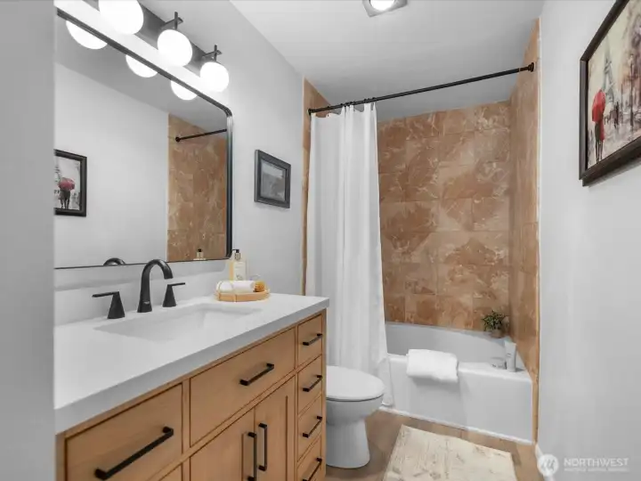 Updated vanity in the bathroom and a spacious bath tub. Updated vanity in the bathroom and a spacious bath tub.