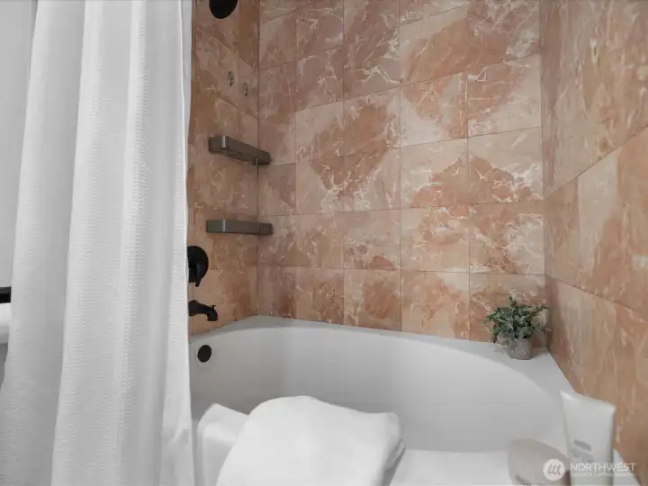 Tiled bath tub surround. Tiled bath tub surround.