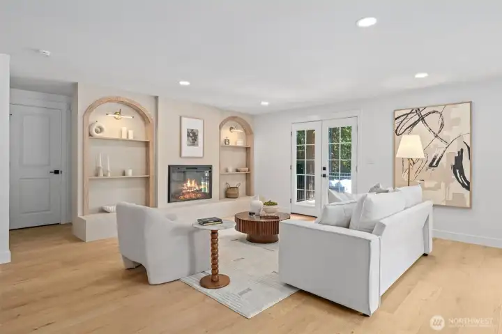 This home reveals the full scale of the open-concept great room, where soaring recessed lighting and an oversized picture-framed art niche draw the eye across the space. French doors open directly to the wooded backdrop, and the room flows seamlessly into the adjoining chef's kitchen for easy everyday living. This home reveals the full scale of the open-concept great room, where soaring recessed lighting and an oversized picture-framed art niche draw the eye across the space. French doors open directly to the wooded backdrop, and the room flows seamlessly into the adjoining chef's kitchen for easy everyday living.