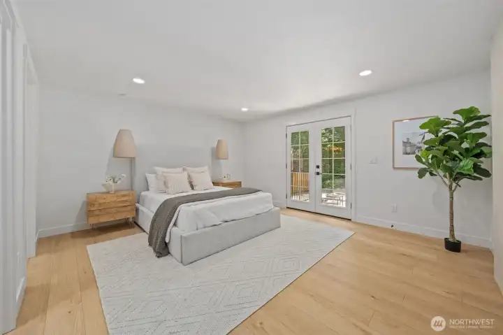 Welcome to the Primary Suite, your private spa-like retreat away from the main living space, featuring a walk-in closet and spa-like ensuite. French doors open to a private deck, framed by soft pendant lighting and wide-plank engineered hardwood throughout. Welcome to the Primary Suite, your private spa-like retreat away from the main living space, featuring a walk-in closet and spa-like ensuite. French doors open to a private deck, framed by soft pendant lighting and wide-plank engineered hardwood throughout.