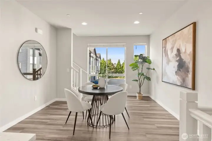 Expansive windows fill the space with natural light.