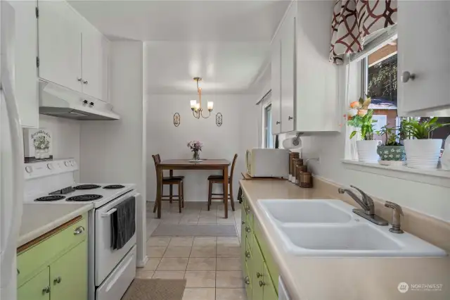 Classic galley-style kitchen that overlooks the back yard.  The huge laundry room is behind this photo.