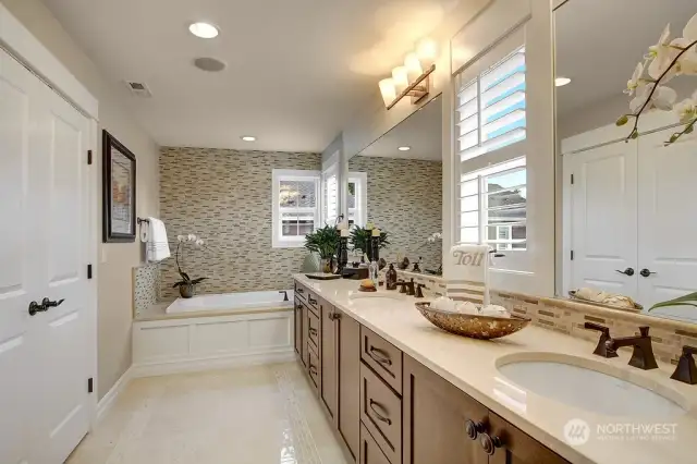 The master bath features a large dual-sink vanity, soaking tub, and tiled separate shower. Photo for illustration purposes only & not of actual home available for sale. The Elm design by Toll Brothers built in a previous community.