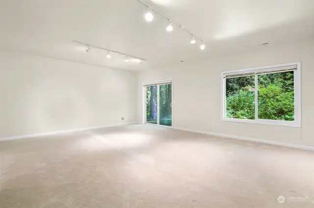 Massive bonus room seen without furniture.