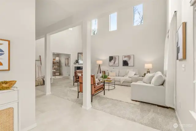 Abundant natural light pours through the windows - gorgeous columns and vaulted ceiling help create an airy ambiance.