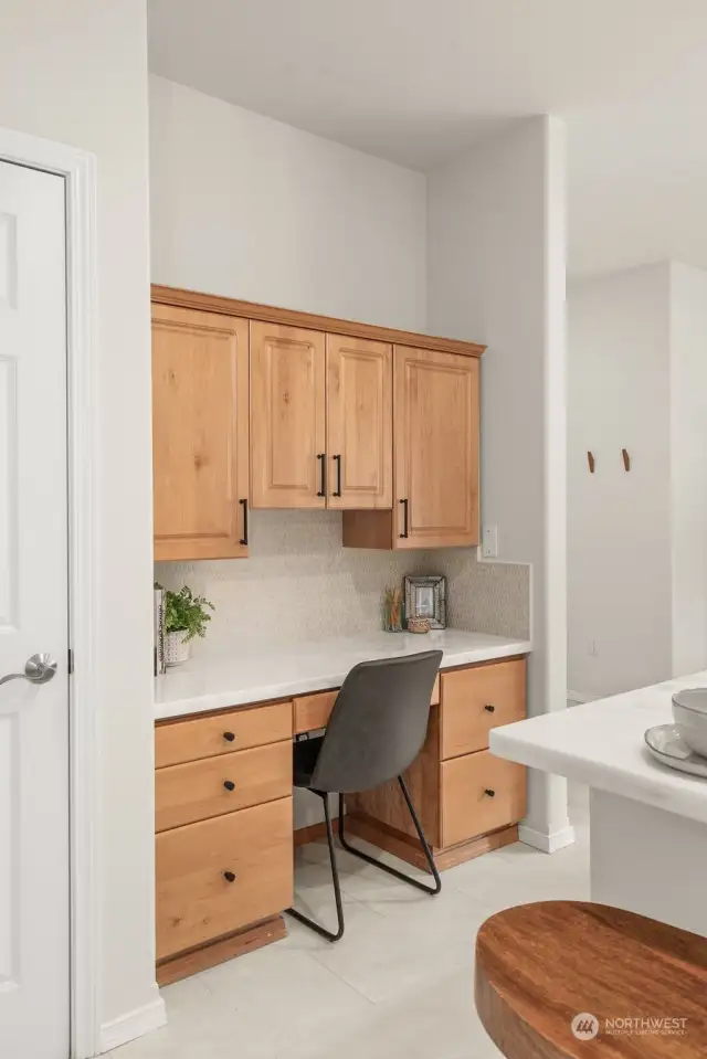 Walk-in pantry to left of this work nook.