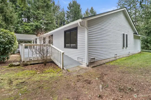 View of accessible ramp and spacious back deck.