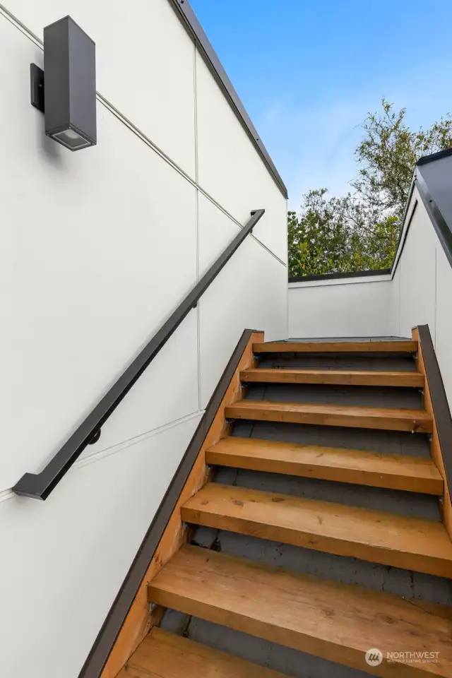 These sleek rooftop stairs lead to your private outdoor escape—where fresh air, open skies, and incredible views await. Morning coffee spot? Sunset unwind zone? The choice is yours.