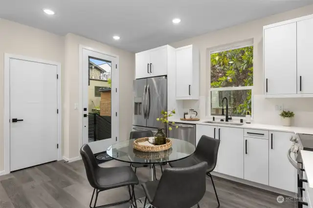 A kitchen that does it all! Crisp white cabinetry, high-end appliances, and plenty of counter space? Yes, please!