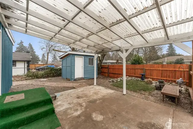 Covered patio and storage shed Unit 513.