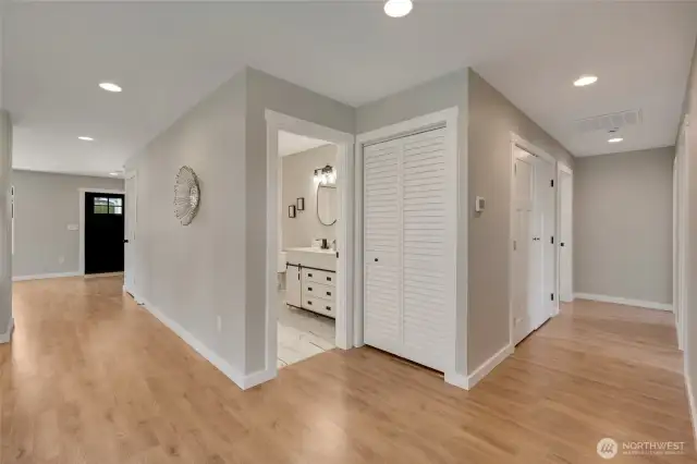 This intersecting hallway design makes the second bathroom and linen closet easily accessible from all areas.