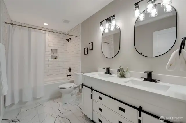 A full bath with a double vanity, providing plenty of space for busy mornings.